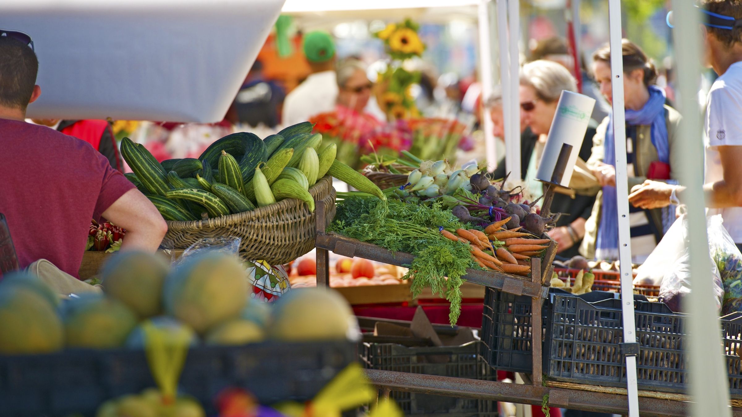Locals at a busy outdoor produce market